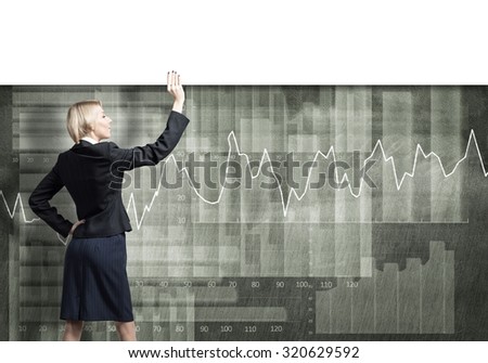 Young businesswoman lifting white blank banner above head