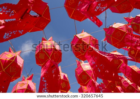 Bright red paper lanterns decorate a Buddhist temple in Chiang Mai, Thailand
