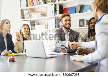 Business shaking hand with a client in office Royalty-Free Stock Photo #320667095