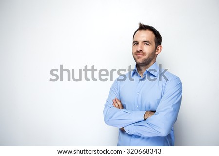 Photo of businessman with beard wearing shirt. Businessman looking at camera. Isolated on white background