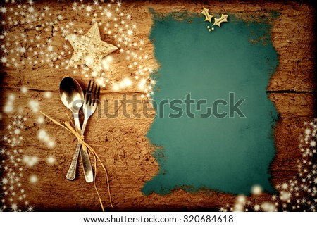 Background for writing the Christmas menu, parchment on old wooden table with stars Royalty-Free Stock Photo #320684618