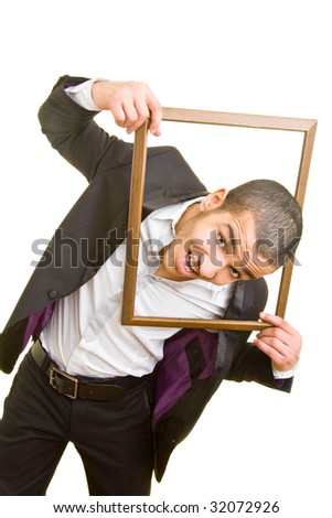 Young business man putting his head through an empty frame