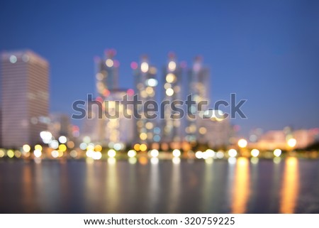 Blur picture of Benjakitti Nation Park cityscape at night time.