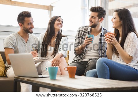 Group of friends meeting In the local Coffee Shop Royalty-Free Stock Photo #320768525