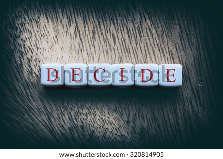 DECIDE word written on white cubes