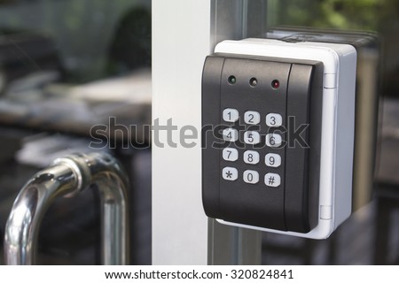 black security door have a number bottom and led light red yellow green Royalty-Free Stock Photo #320824841
