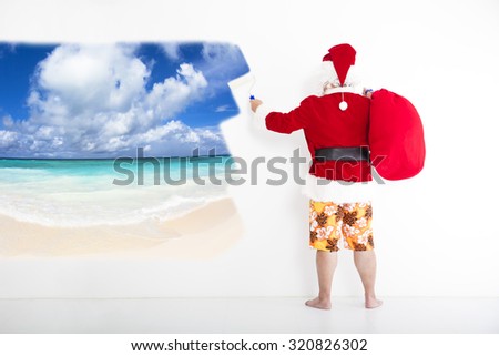santa claus with beachwear and painting vacation concept on the wall