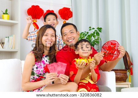 Asian family celebrate chinese new year Royalty-Free Stock Photo #320836082