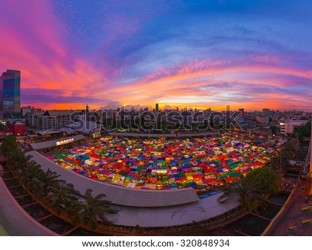 Bird eyes view of Multi-colored tents /Sales of second-hand market at twilight - Panorama picture