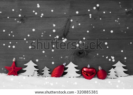 Festive Christmas Decoration On White Snow. Christmas Ball, Christmas Tree, Snowflakes. Rustic, Vintage Wooden Background. Copy Space For Advertisement. Black And White Image With Red Color Hotspot
