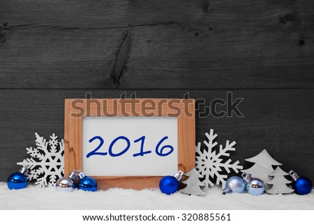 Blue Gray Christmas Decoration On Snow. Christmas Tree Balls, Snowflake And Christmas Tree. Picture Frame With Text 2016. Rustic, Vintage Brown Wooden Background. Black And White Image