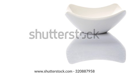 Square white bowl over white background
