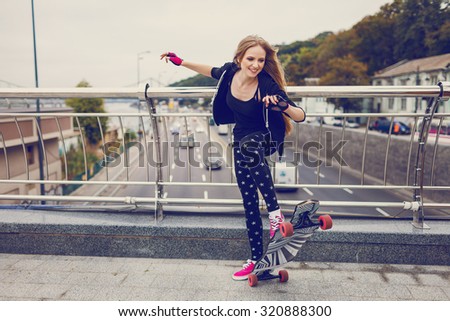 Shot of a young woman out skateboarding in the city