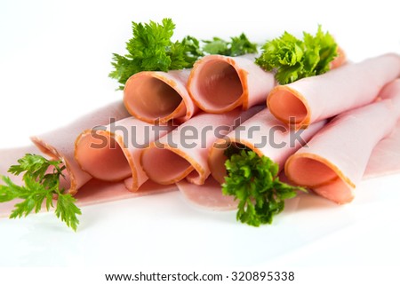 Rolled ham with parsley. Royalty-Free Stock Photo #320895338