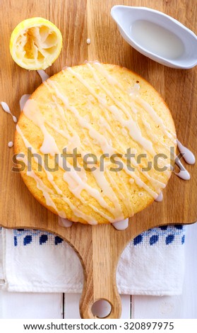 Sticky lemon cake with icing drizzle top view