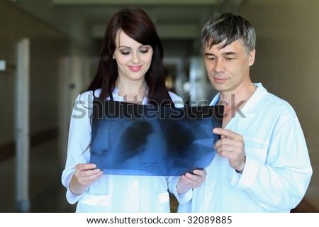 Medical theme: doctors are studying x-ray.