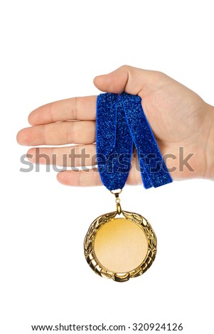 Gold medal in hand isolated on white background