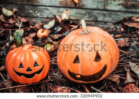Happy Halloween. Holiday pumpkins and decorations. Pumpkin on autumn street. Preparations for the holiday decoration bats and manufacturing Hallowe'en pumpkin