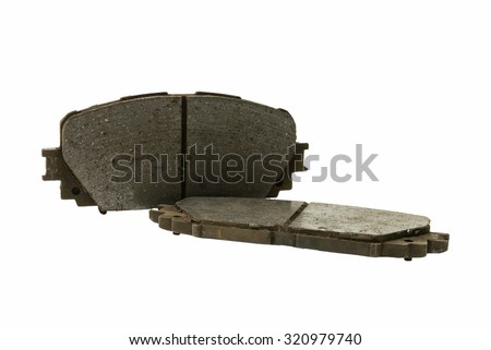 old used corroded disc brake pad (automobile spare part) isolated on white background