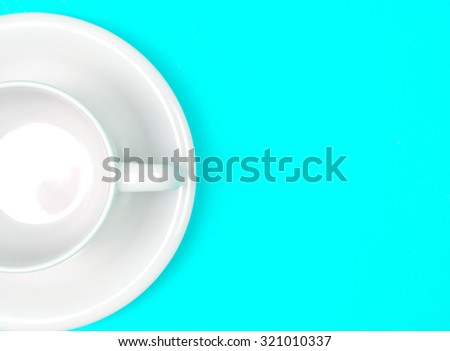 empty  the white coffee or tea cup on vibrant blue color background with text space