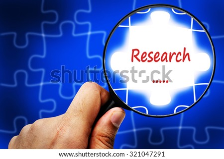 research word. Magnifier and puzzles.
