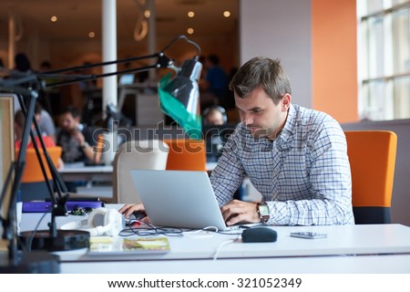 startup business, software developer working on computer at modern office Royalty-Free Stock Photo #321052349
