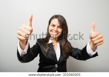 Business woman shows thumb up