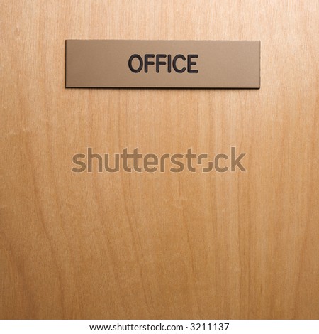 Office sign on wooden door.