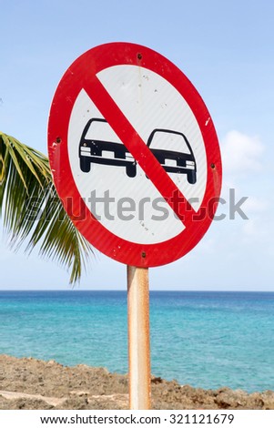 No overtaking sign with blue sea and sky background
