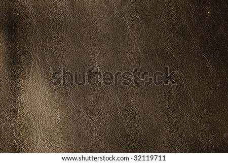 natural dark gold leather background close-up