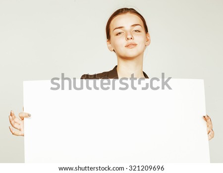 young pretty brunette girl with placard on white background wearing business costume student