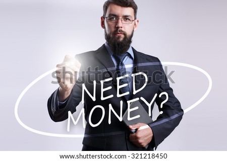 Businessman writing "Need money?" with marker on transparent board.