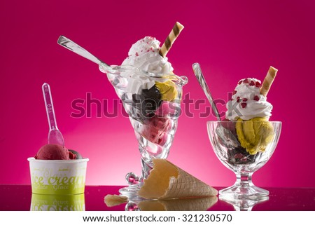 colorful sundaes and takeaway plastic cup decorated on pink background