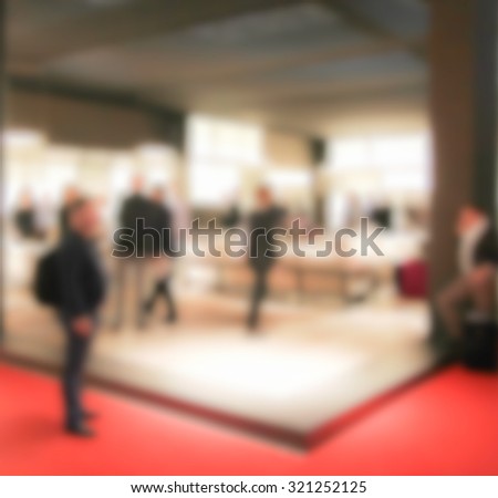 People not recognizable in interiors, generic background. Intentionally blurred post production.