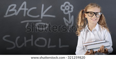 Back to school - Young girl with books