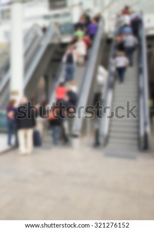 Trade show background with people, intentionally blurred post production.