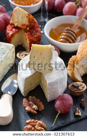 molded cheeses, grapes and snacks, vertical
