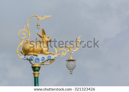 golden rabbit at top pillar 