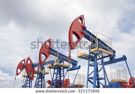 Oil pump jack. Oil and gas industry. Oil field