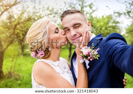 Beautiful young wedding couple outside in nature