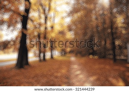 blurred background trees in autumn city park