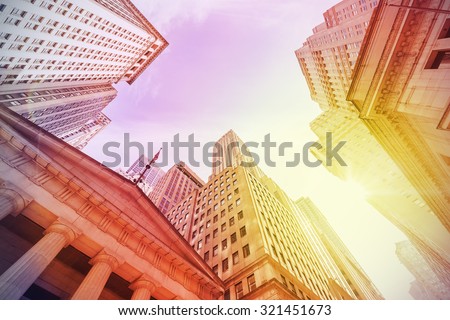 Vintage instagram filtered Wall Street at sunset, Manhattan, New York City, USA.