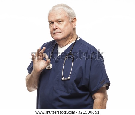 Senior doctor or nurse giving the A-OK sign while looking at camera.