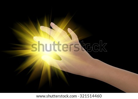  Boy hand reach for grabs on black background and lights abstract.
