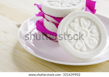 Kind of Chinese pancake made of rice-flour on wooden background