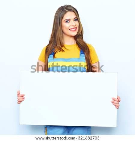 Young woman hold sign board. Portrait of smiling builder woman on white background.
