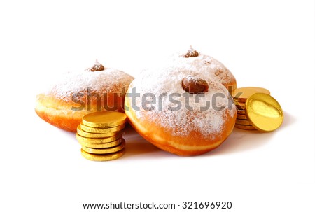 image of jewish holiday Hanukkah with donuts, traditional chocolate coins and wooden dreidels (spinning top). isolated on white
