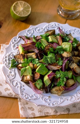 Roasted Eggplant Salad with Avocado and Red Onion. Close-up.