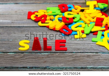 Sale text on wood background