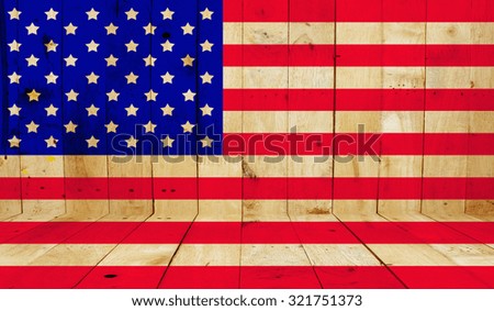 The USA flag painted on wooden background.